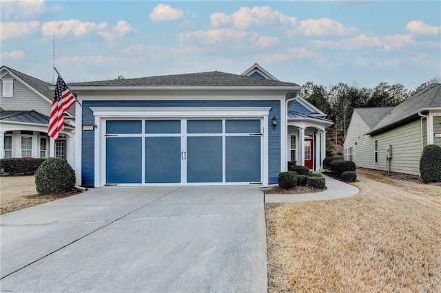 view of front of property featuring driveway and an attached garage