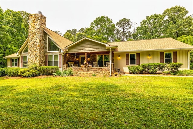 130 Brooklet Way, Brooks, GA 30205 - view of front of home with a front lawn, a chimney, and covered porch