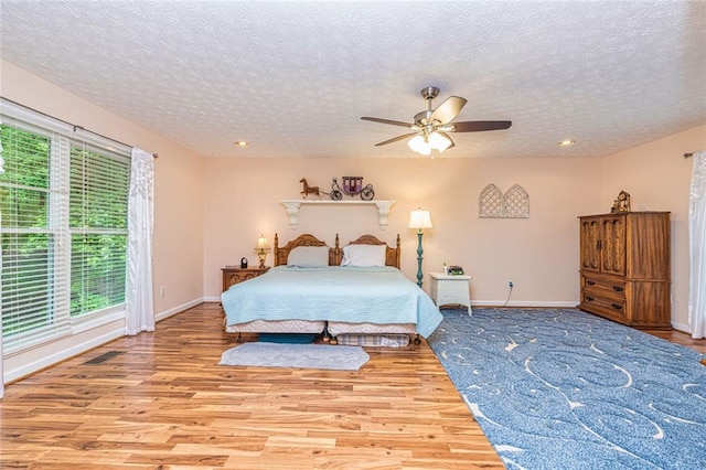 130 Brooklet Way, Brooks, GA 30205 - bedroom featuring a textured ceiling, wood finished floors, recessed lighting, and a ceiling fan