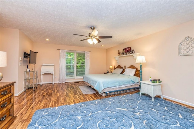 130 Brooklet Way, Brooks, GA 30205 - bedroom with wood finished floors, a ceiling fan, and a textured ceiling