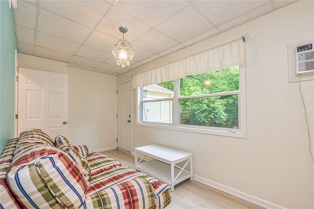 130 Brooklet Way, Brooks, GA 30205 - living area featuring light wood finished floors, a paneled ceiling, and a chandelier