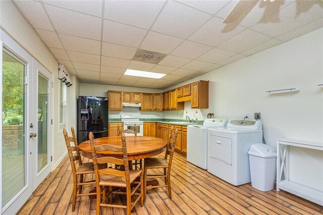 130 Brooklet Way, Brooks, GA 30205 - dining space featuring washing machine and clothes dryer, light wood-type flooring, and a drop ceiling