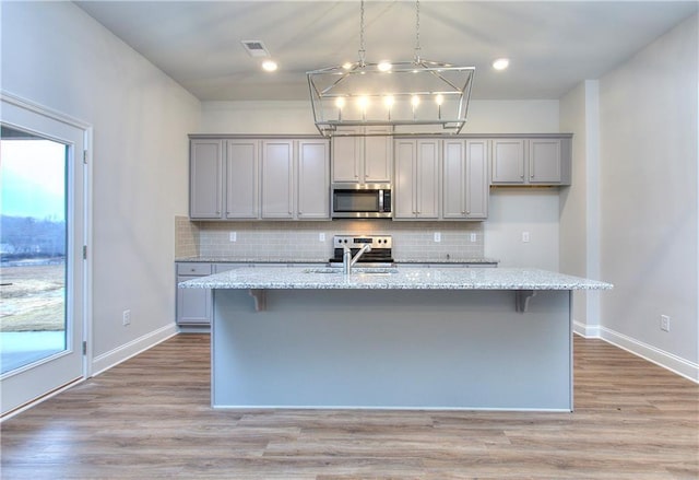 96 Sherwood Dr, Commerce, GA 30529 - kitchen with a sink, a wealth of natural light, appliances with stainless steel finishes, and gray cabinets