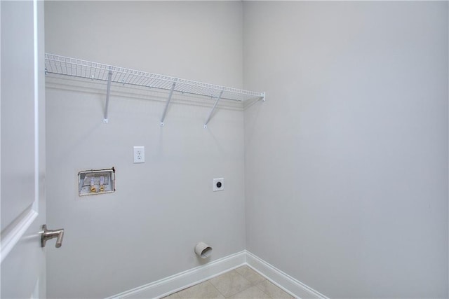 96 Sherwood Dr, Commerce, GA 30529 - laundry area with baseboards, washer hookup, electric dryer hookup, laundry area, and light tile patterned floors
