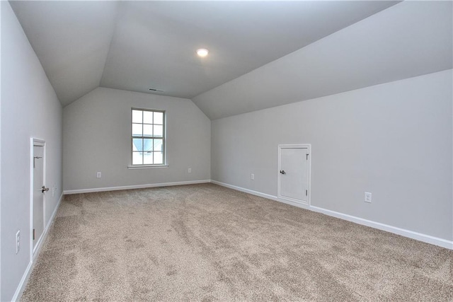 96 Sherwood Dr, Commerce, GA 30529 - additional living space featuring visible vents, vaulted ceiling, baseboards, and carpet floors