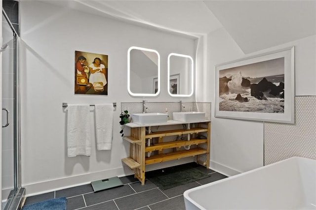3143 Church St, East Point, GA 30344 - bathroom with a freestanding tub, a shower stall, double vanity, and tile patterned floors