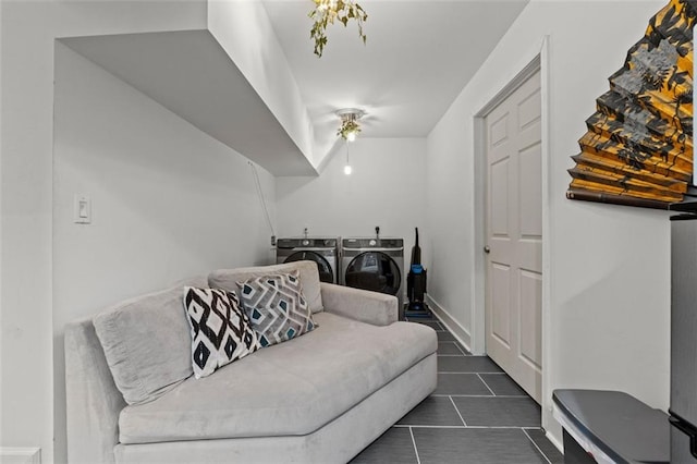 3143 Church St, East Point, GA 30344 - sitting room featuring washer and dryer and dark tile patterned floors