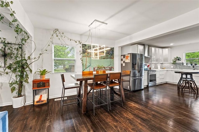 3143 Church St, East Point, GA 30344 - dining room featuring dark wood-style flooring and a chandelier
