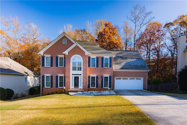 colonial-style house with a front yard