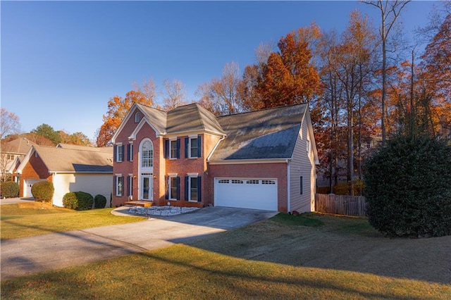 view of front of house featuring a garage and a front yard