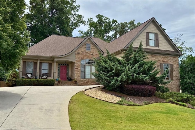 1976 Hedge Brooke Trl NW, Acworth, GA 30101 - view of front of house with stone siding, a front yard, a porch, and driveway