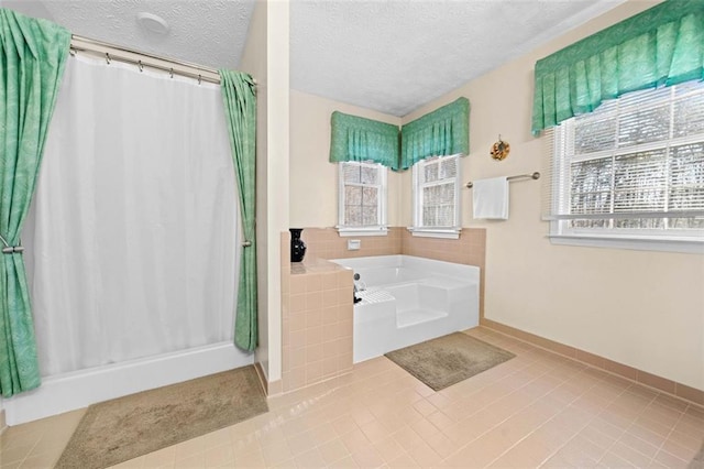 full bathroom with a shower stall, a bath, and tile patterned floors