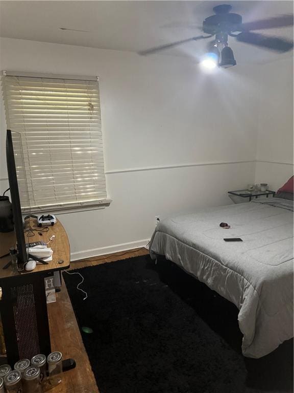 bedroom featuring hardwood / wood-style flooring and ceiling fan