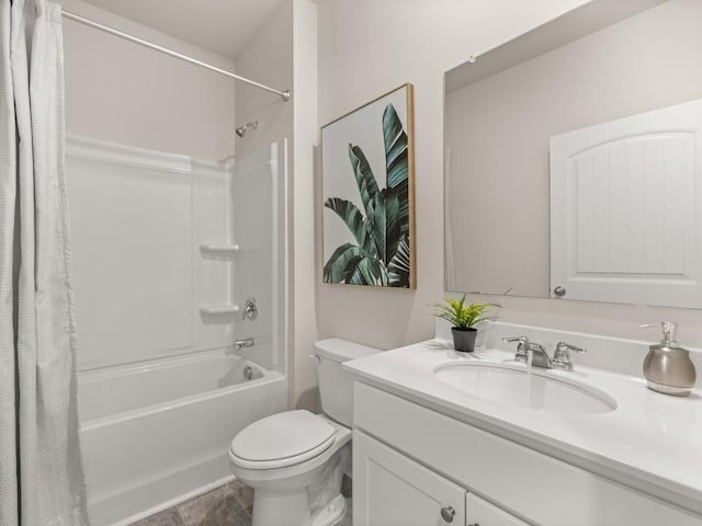 full bathroom with vanity, shower / bath combo, and toilet