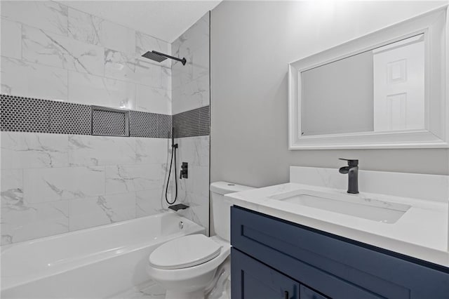 full bathroom featuring tiled shower / bath, vanity, and toilet