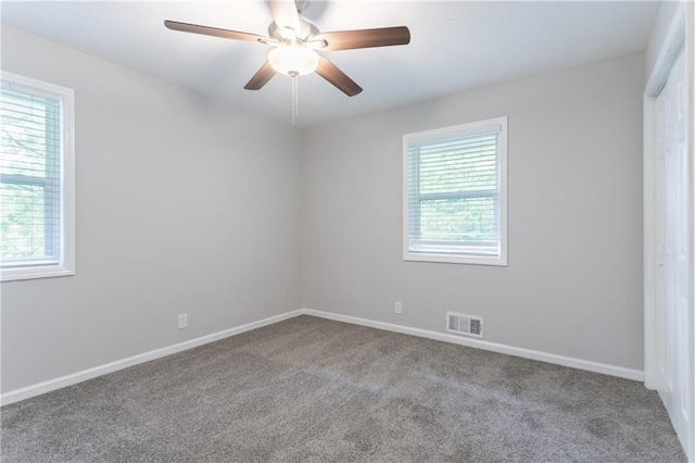 5795 Deerfield Trl, Atlanta, GA 30349 - carpeted spare room featuring baseboards and ceiling fan