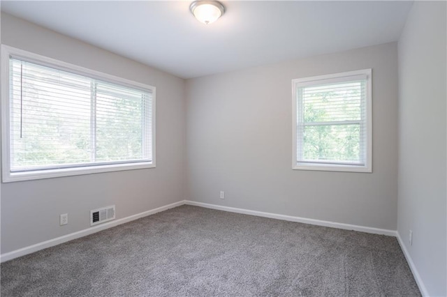 5795 Deerfield Trl, Atlanta, GA 30349 - spare room with carpet floors and baseboards