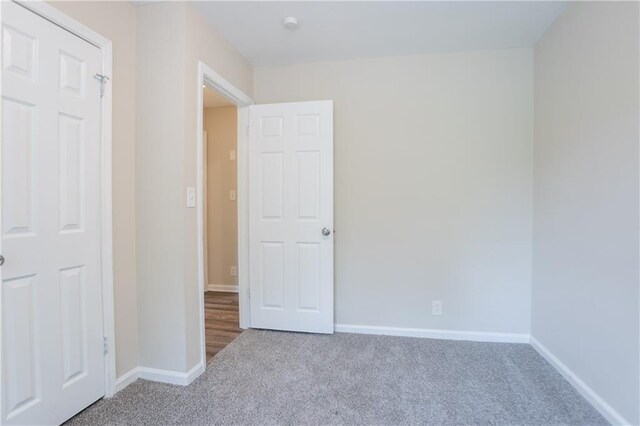 5795 Deerfield Trl, Atlanta, GA 30349 - unfurnished bedroom with carpet flooring and baseboards