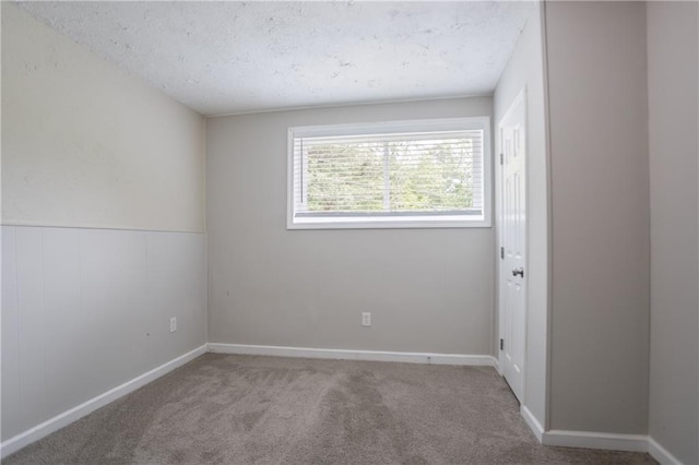 5795 Deerfield Trl, Atlanta, GA 30349 - carpeted empty room featuring a textured ceiling
