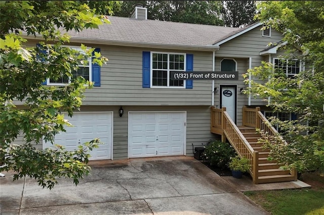 5624 Ryan Way, Flowery Branch, GA 30542 - bi-level home featuring an attached garage, concrete driveway, a chimney, and a shingled roof
