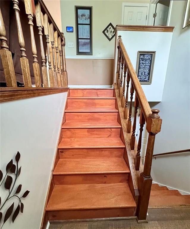 5624 Ryan Way, Flowery Branch, GA 30542 - staircase featuring wood finished floors