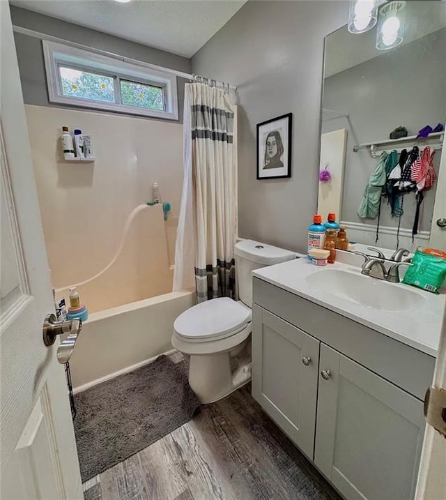 5624 Ryan Way, Flowery Branch, GA 30542 - full bathroom featuring wood finished floors, vanity, and shower / bathtub combination with curtain