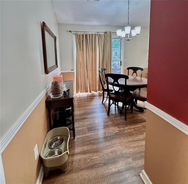 5624 Ryan Way, Flowery Branch, GA 30542 - dining area with a chandelier and wood finished floors