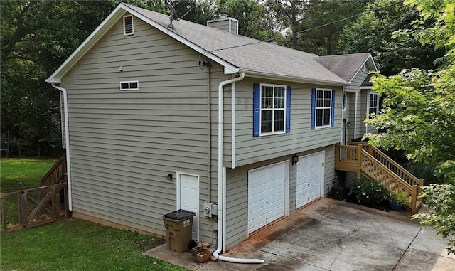 5624 Ryan Way, Flowery Branch, GA 30542 - view of home's exterior featuring a chimney, a garage, stairs, roof with shingles, and driveway