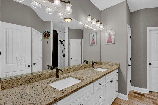 full bathroom with vanity, baseboards, toilet, and marble finish floor
