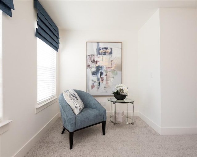 living area featuring light colored carpet