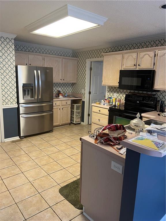 50 Ranger Rd SE, Cartersville, GA 30121 - kitchen featuring black appliances, wallpapered walls, light tile patterned flooring, light countertops, and tasteful backsplash