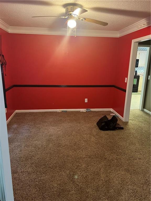 50 Ranger Rd SE, Cartersville, GA 30121 - carpeted empty room with a ceiling fan, a textured ceiling, and ornamental molding