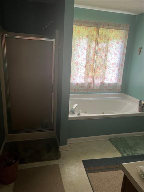 50 Ranger Rd SE, Cartersville, GA 30121 - full bathroom featuring a stall shower, a whirlpool tub, vanity, tile patterned floors, and a textured ceiling