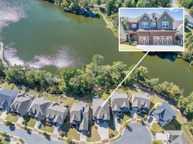 birds eye view of property featuring a water view