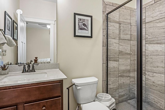 full bath with a shower stall, toilet, and vanity