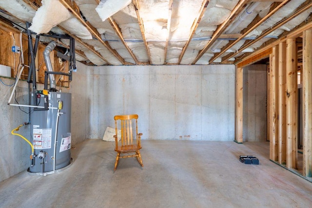 unfinished basement featuring gas water heater