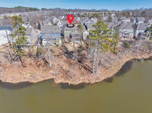 birds eye view of property with a residential view and a water view