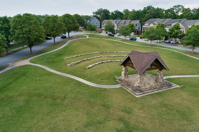 surrounding community featuring a gazebo, a yard, and a residential view