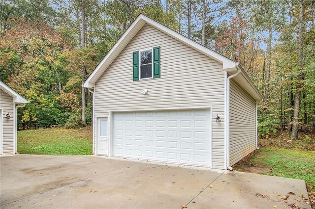 garage with concrete driveway