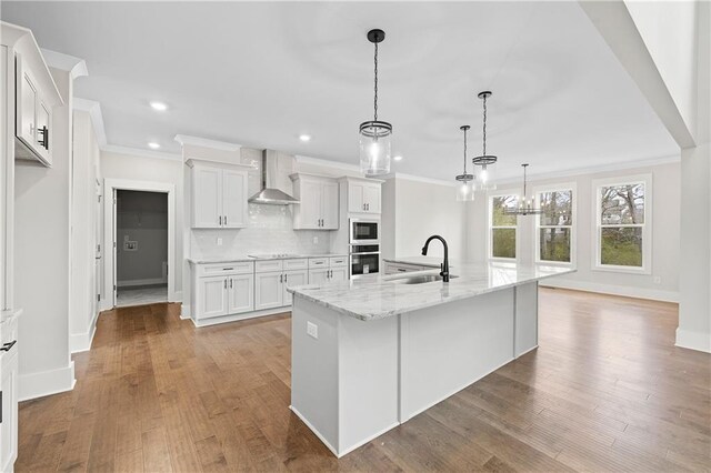 171 Blue Rider Trl, Hoschton, GA 30548 - kitchen with ornamental molding, wall chimney range hood, black electric cooktop, a sink, and backsplash