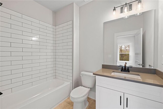 171 Blue Rider Trl, Hoschton, GA 30548 - bathroom featuring tile patterned flooring, vanity, toilet, baseboards, and shower / washtub combination