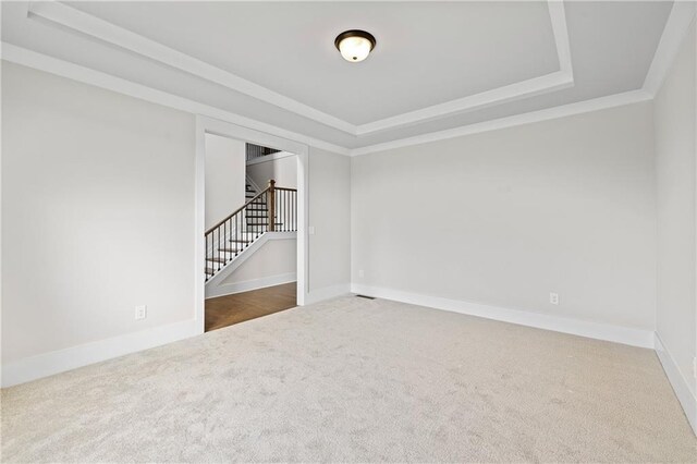 171 Blue Rider Trl, Hoschton, GA 30548 - carpeted empty room featuring baseboards, crown molding, a tray ceiling, and stairway