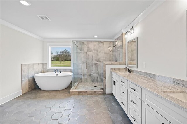 171 Blue Rider Trl, Hoschton, GA 30548 - bathroom with a freestanding bath, a sink, double vanity, a shower stall, and visible vents