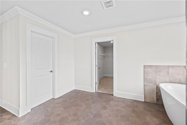 171 Blue Rider Trl, Hoschton, GA 30548 - bathroom featuring recessed lighting, a freestanding tub, baseboards, a spacious closet, and visible vents