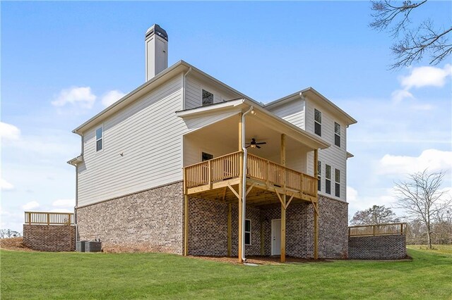 171 Blue Rider Trl, Hoschton, GA 30548 - back of property featuring a lawn, brick siding, ceiling fan, and a deck