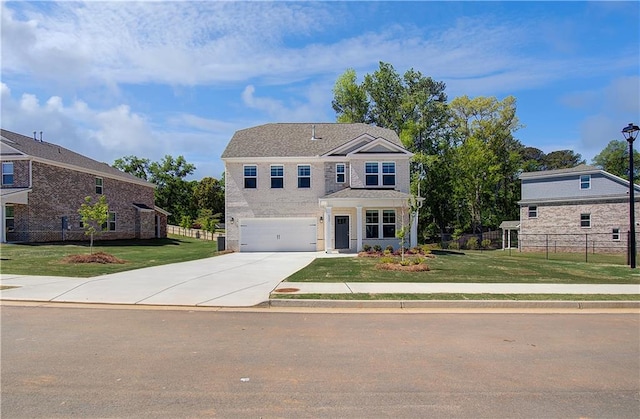 237 Chiswick Loop, Stockbridge, GA 30281 - traditional home with a garage, a front yard, concrete driveway, and fence
