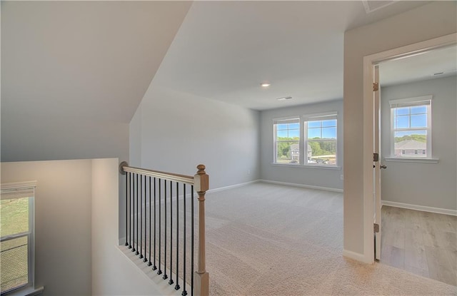 237 Chiswick Loop, Stockbridge, GA 30281 - corridor with carpet floors, an upstairs landing, and baseboards