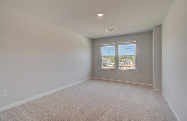 237 Chiswick Loop, Stockbridge, GA 30281 - empty room featuring baseboards, visible vents, and light colored carpet