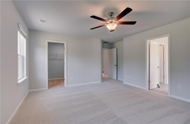 237 Chiswick Loop, Stockbridge, GA 30281 - unfurnished bedroom featuring light carpet, baseboards, visible vents, and a spacious closet