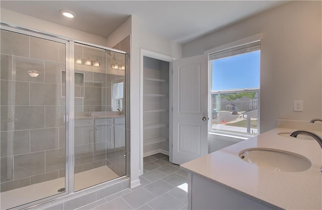 237 Chiswick Loop, Stockbridge, GA 30281 - full bath featuring recessed lighting, a shower stall, tile patterned floors, double vanity, and a sink